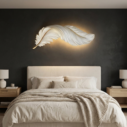 Feather LED wall lamp glowing horizontally above a bed on a charcoal feature wall
